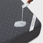 waterproof mattress protector with solid color and prismatic print, gray