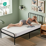 a woman is lying on the waterproof prismatic print noiseless mattress protector, white